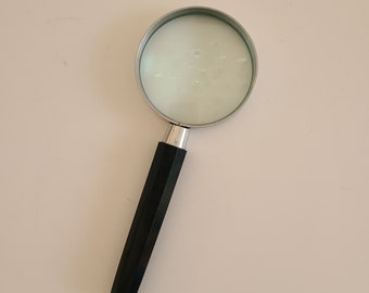 Vintage circa 1960's magnifying glass by The Swift Co Inc, Made in Japan 3" glass 7 3/4" overall length