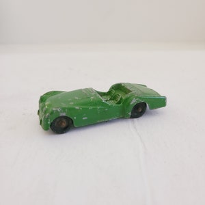Vintage late 1960&#39;s Tootsietoy car, Triumph TR-3, chippy green paint.