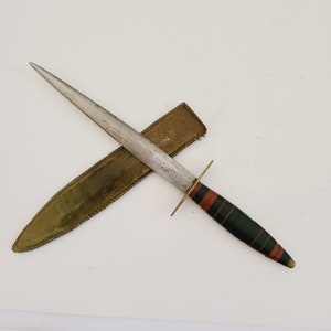 Antique  early 1900&#39;s, boot knife possibly a letter opener hardened steel with brass blade guard and pommel, Ebonite handle, leather sheath