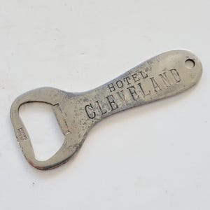 Vintage circa 1930&#39;s scarce advertising bottle opener for the Hotel Cleveland, opened in 1918 National Historic Hotel