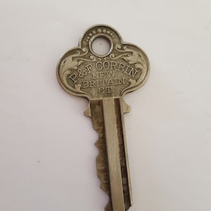 Antique/vintage circa 1930 P.&F. Corbin New Britain CT ornate lock key, nickel plated brass