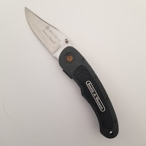 Vintage circa 1990&#39;s Smith & Wesson Bullseye folding knife, lockback style with belt clip, surgical steel blade