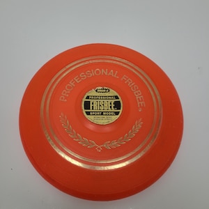 Vintage 1965 Frisbee Offical Pro Model by Wham-o, good used shape, with sticker, 1st generation with instructions underneath!