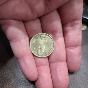 Vintage novelty coin, Heads I win, Tails you lose, polished brass, topless woman on heads side, bottomless on tails.