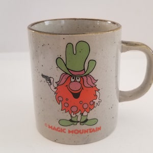 Vintage 1970's earthenware coffee cup Magic Mountain  used condition King Blop aka "Bloop" mascot as a cowboy.