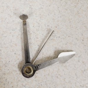 Vintage 1950&#39;s advertising pocket/keyring pipe tool, Atmos Pipe Kit, tamper, bowl scraper, ream, cleaned, used. Measures 3&quot; Made in USA