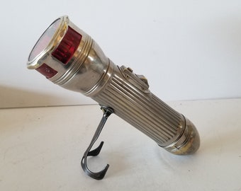 Vintage circa 1920's-1930's USALITE "Redhead" auto safety flashlight, good used condition with expected wear, collapsing kickstand