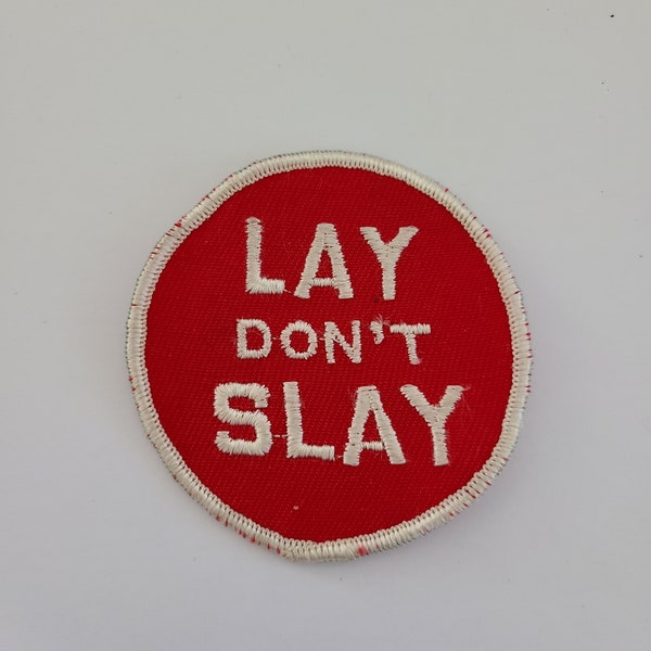 Vintage circa late 1960's novelty embroidered patch, anti-war " Lay Don't Slay" old stock