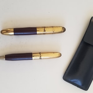 Vintage 1950&#39;s miniature fountain pen and mechanical pencil with gold color nib, lever fill untested pencil works vinyl case