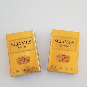 Vintage circa 1985 pair of matchboxes for short-lived cigarette brand St. James Court. Excellent condition