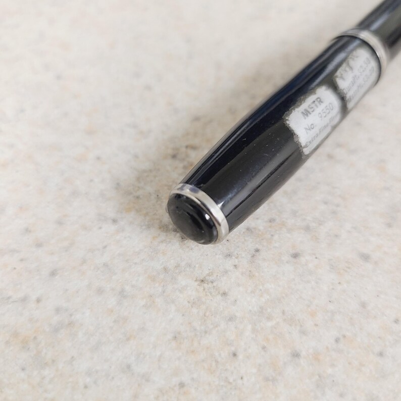 May include: A set of three ceramic mugs with a speckled, matte finish. The mugs are in shades of cream, light gray, and dark gray. Each mug has a simple, modern design and a rounded handle. The mugs are stacked on top of each other.