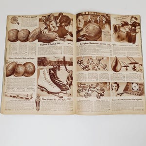 May include: An open book with a brown cover and white pages. The book features images and text about sports equipment for children. The text includes "Why Paralyde is Tough", "Toughest Football 98", "Complete Basketball Set 99", "Weaver Scholastic Balls Last Longer", "Shoe Skates for Little Tots 1239", and "Improve Your Marksmanship with Targetour".