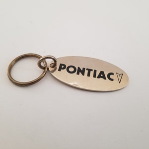 Vintage 1980s Pontiac Brass Keyring: Embossed Auto Emblem