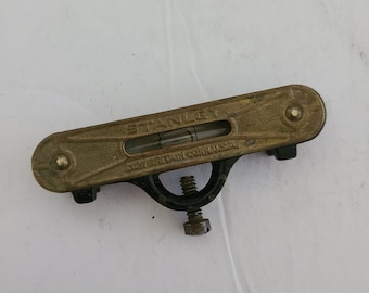 Antique Stanley carpenter single bubble level, brass and steel with adjustable screw for attaching to a straight edge. New Britain Conn USA