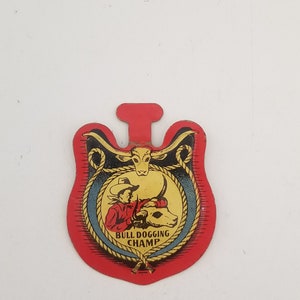 Vintage Post Cereal premium Bulldogging Champ1953 TV Westerns,  Raisin Brand fold over pocket pin used good condition