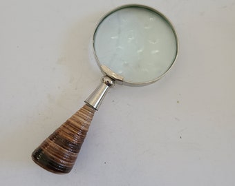 Vintage medium magnifying glass,  metal frame seashell handle. Marked Japan 2 1/2" diameter glass magnifier