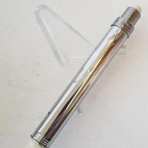 Vintage unmarked exam/ penlight flashlight,  white plastic behive tip probably 1960&#39;s includes 2 AA batteries losses to finish, multiples