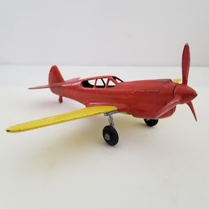 Vintage circa 1960&#39;s Hubley Kiddie-toy fixed wings P-40 aircraft, complete with landing gear and prop