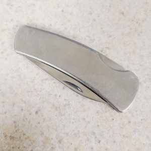 Vintage circa 1980's Stainless Steel lock back pocket knife 2" blade The Newark Group