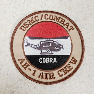 May include: A rustic wooden sign with the text "Welcome to our porch" in white lettering. The sign features a distressed finish and a simple, inviting design, perfect for outdoor decor.