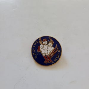 Vintage 1970&#39;s enamel ski pin &quot;Afton Alps&quot; nice condition great imagery of a snowman and woman on a chairlift, measures 1 1/4&quot;