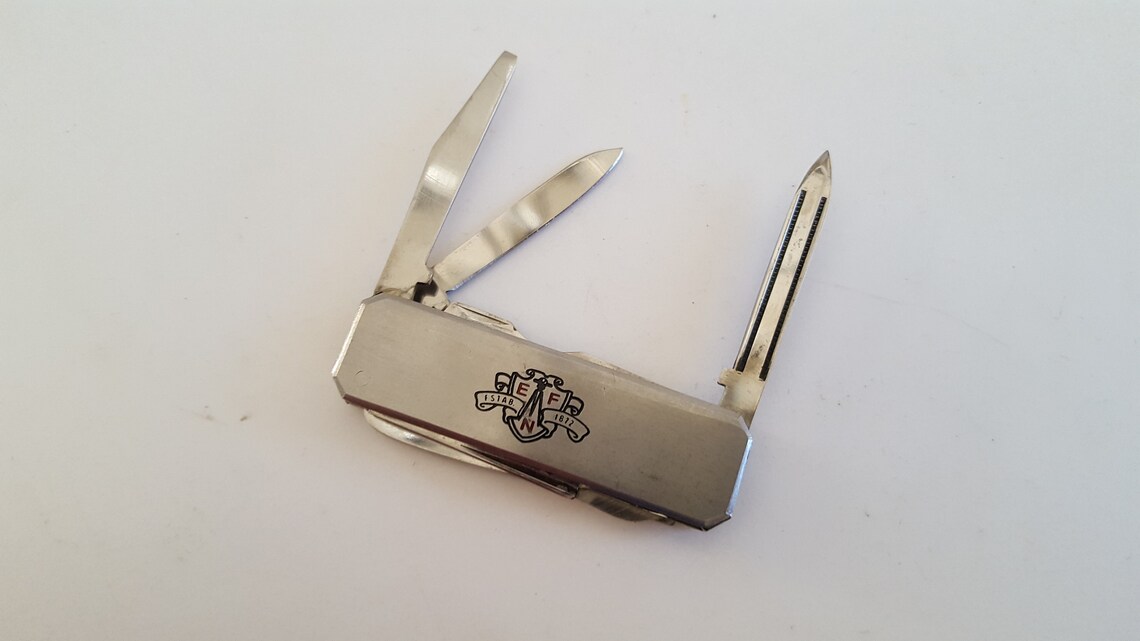 Vintage circa 1980's advertising knife Egan Field and Etsy