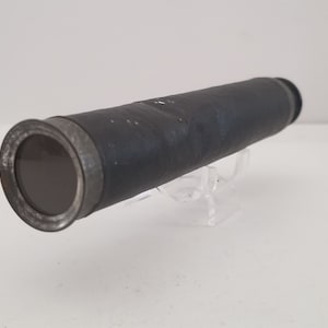 Vintage possibly antique spyglass, unmarked, single lense unmarked with dents. Measures 6 3/4"