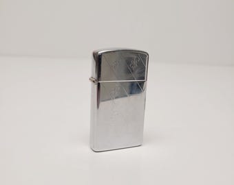 Vintage 1980 Zippo Slim windproof cigarette lighter, needs flint fluid