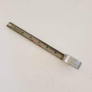 Vintage late 1920&#39;s to 1930&#39;s Art Deco Master Rule Mfg. tape measure, steel, stamped steel case, original nice condition. 6&#39;