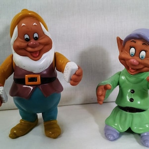 Happy And Dopey Figures From Snow White And The Seven Dwarfs