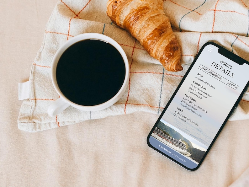 May include: A white coffee cup filled with black coffee, a golden croissant, and a smartphone displaying cruise details. The phone shows information about a Royal Caribbean cruise, including the ship, stateroom, and price.