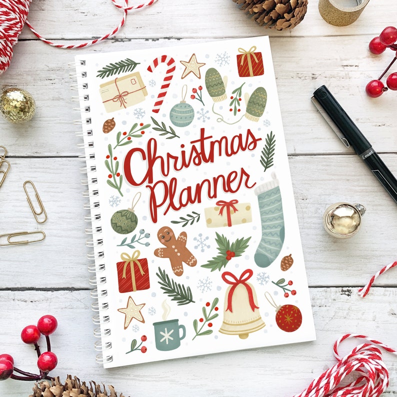 Cover of the Christmas Planner booklet that includes hand drawn illustrations of Christmas things such as candy cane, stocking, bell, gingerbread man, presents, gloves, holly, and botanical plants