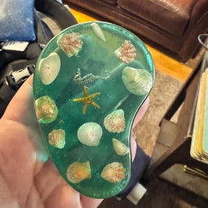 Vintage MCM kidney shaped Lucite Acrylic Aqua Seashell seahorse starfish kitsch desk paper weight