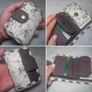 May include: A handmade wallet with a floral pattern and a brown polka dot interior. The wallet features a snap closure and a gingham border. The interior has card slots and a coin pouch. The wallet is approximately 4.5 inches wide and 3.5 inches tall.