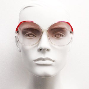 70s vintage oversized round sunglasses. Womens transparent lucite frame with red accents and sensational light tone gradient lenses