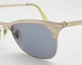 50s vintage 12K gold filled cat eye sunglasses. Radiant slimline cateye frame with ornate pattern tool work. 40s
