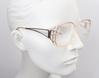 Cheryl Tiegs 80s vintage glasses model 130. Transparent optical frames with stylised gold metal arm . Prescription eyeglasses. RX Spectacles