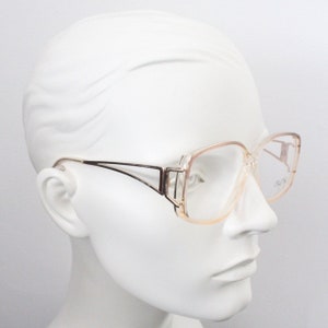 Cheryl Tiegs 80s vintage glasses model 130. Transparent optical frames with stylised gold metal arm . Prescription eyeglasses. RX Spectacles