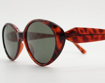 90s vintage oval cat eye sunglasses. Vibrant amber tortoise cateye frame. Womens Classic 60s design cateyes. Rockabilly. NOS