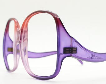 Vintage oversized omgekeerde bril uit de jaren 70. Elegante opstaande armen op een groot rood en paars optisch frame. RX voor dames. NOS