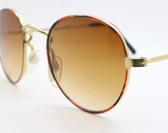 90s vintage tiger print sunglasses. Round metal frame with metallic finish and graduating brown lenses. Panto