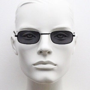 90's vintage micro sunglasses. Black minimal rectangular 60s psychedelic mod style. Club kids rave essentials. Unused NOS