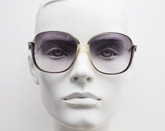 Yves Saint Laurent 70s vintage oversized sunglasses Made in France. Transparent green frame with alluring graduating indigo lenses. YSL