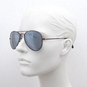 Linda Farrow 70s vintage aviator sunglasses model 137. Brown metal teardrop frame with silver mirror lenses. Luxe Gallery Projects. Pilot