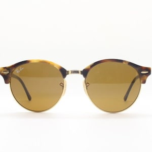 Ray Ban round clubmaster sunglasses model 4246 made in Italy. Rich honey tortoise acetate brow line half frame with brown lenses. Vintage