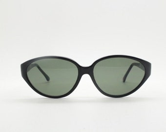 80s vintage cat eye sunglasses. Slender black gloss acetate cateye 50s design frame with green lenses. NOS rockabilly cateyes
