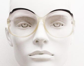 70s vintage oversized sunglasses made in France. Authentic women's crystal frame with black brows and extra light tone lenses