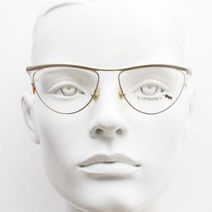 80s vintage flat top cat eye glasses made in Italy by Arrogance. Gold satin and chrome finish optical frame. Prescription RX. NOS spectacles