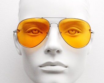 Y2K vintage aviator sunglasses. Bright orange lenses in slim lightweight silver teardrop frame. 2000&#39;s pilot aviators. 70s