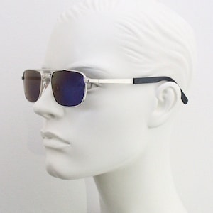 May include: Silver aviator sunglasses with blue tinted lenses and black earpieces.